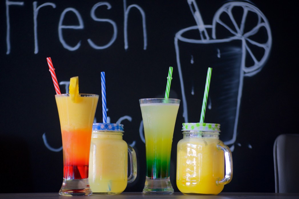 picture of juice in cups with straws
