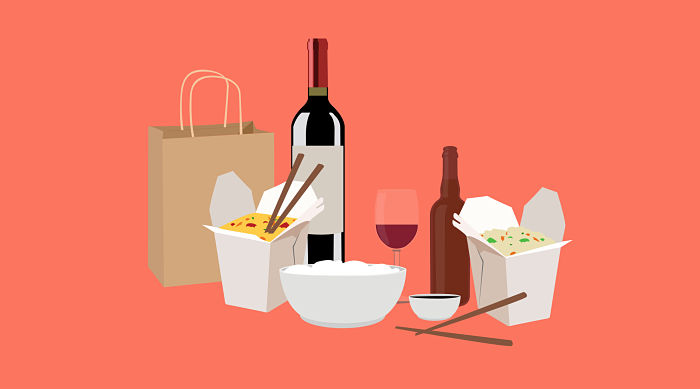 picture of takeout food and a bottle of wine