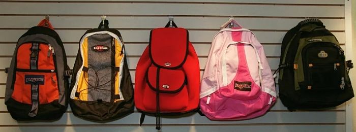 picture of a row of hanging backpacks